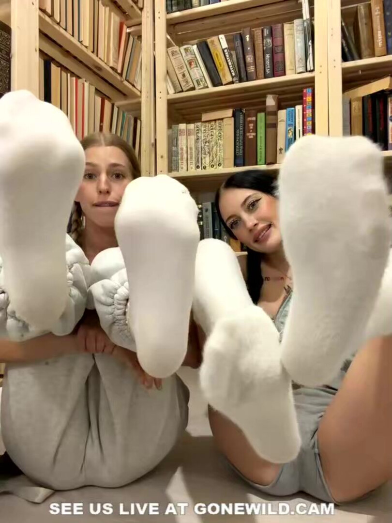 Tattooed Babes with Pigtails Tease in Library - library - pigtails - tattoo - topless - tease - feet - socks - sweats - camgirl - playful