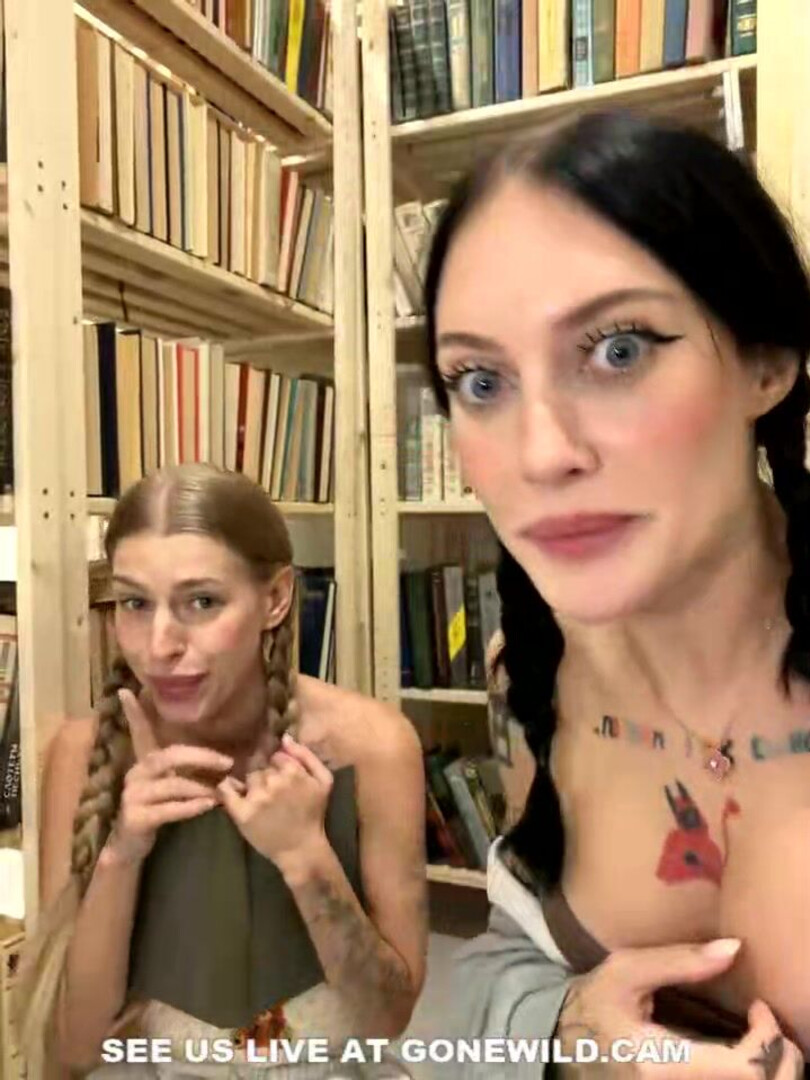 Tattooed Babes with Pigtails Tease in Library - library - pigtails - tattoo - topless - tease - feet - socks - sweats - camgirl - playful