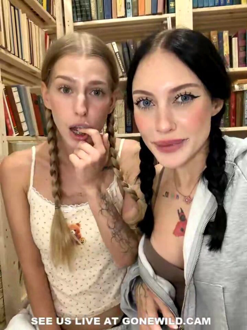 Tattooed Babes with Pigtails Tease in Library - library - pigtails - tattoo - topless - tease - feet - socks - sweats - camgirl - playful
