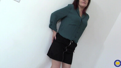 An amorous, older lady from the UK pleasurably touches herself while in her bedclothe - mature - stockings - british - small tits - piercing - high heels - vibrator - solo - female masturbation - pussies