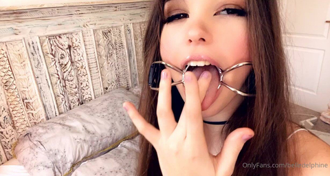 Belle Delphine Licks Fingers With Open Mouth Gag